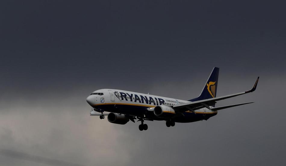 FILE PHOTO:A Ryanair plane prepares to land at Manchester Airport in Manchester
